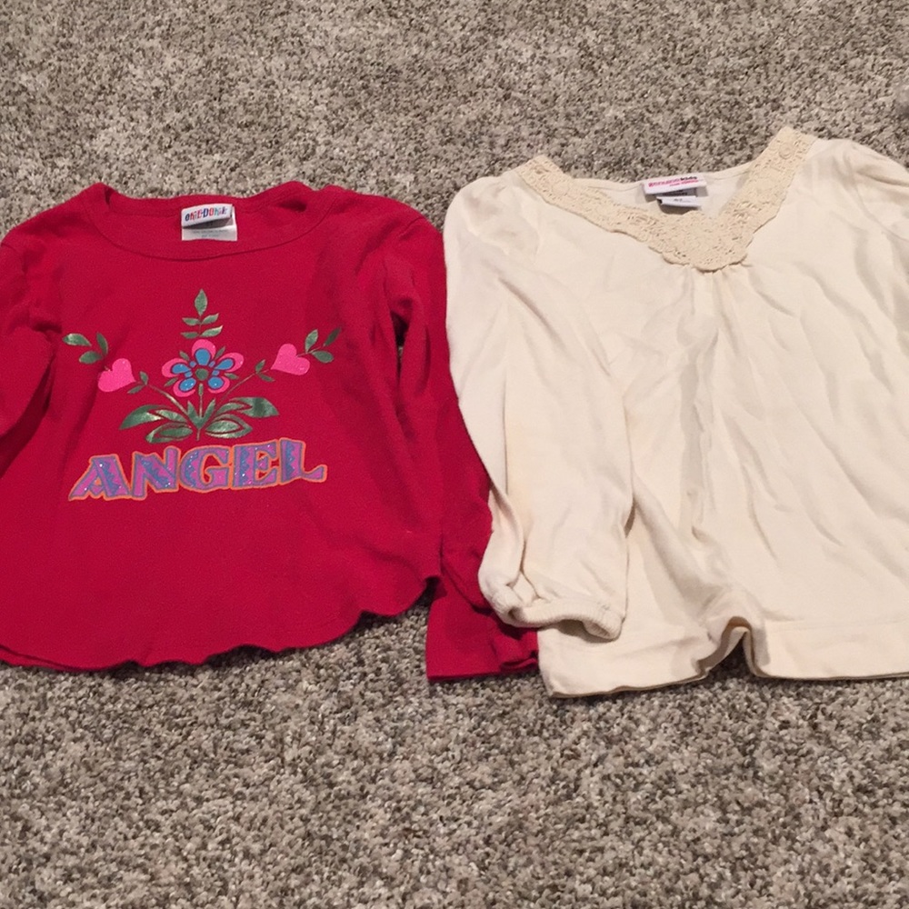 Set of two long sleeve shirts.